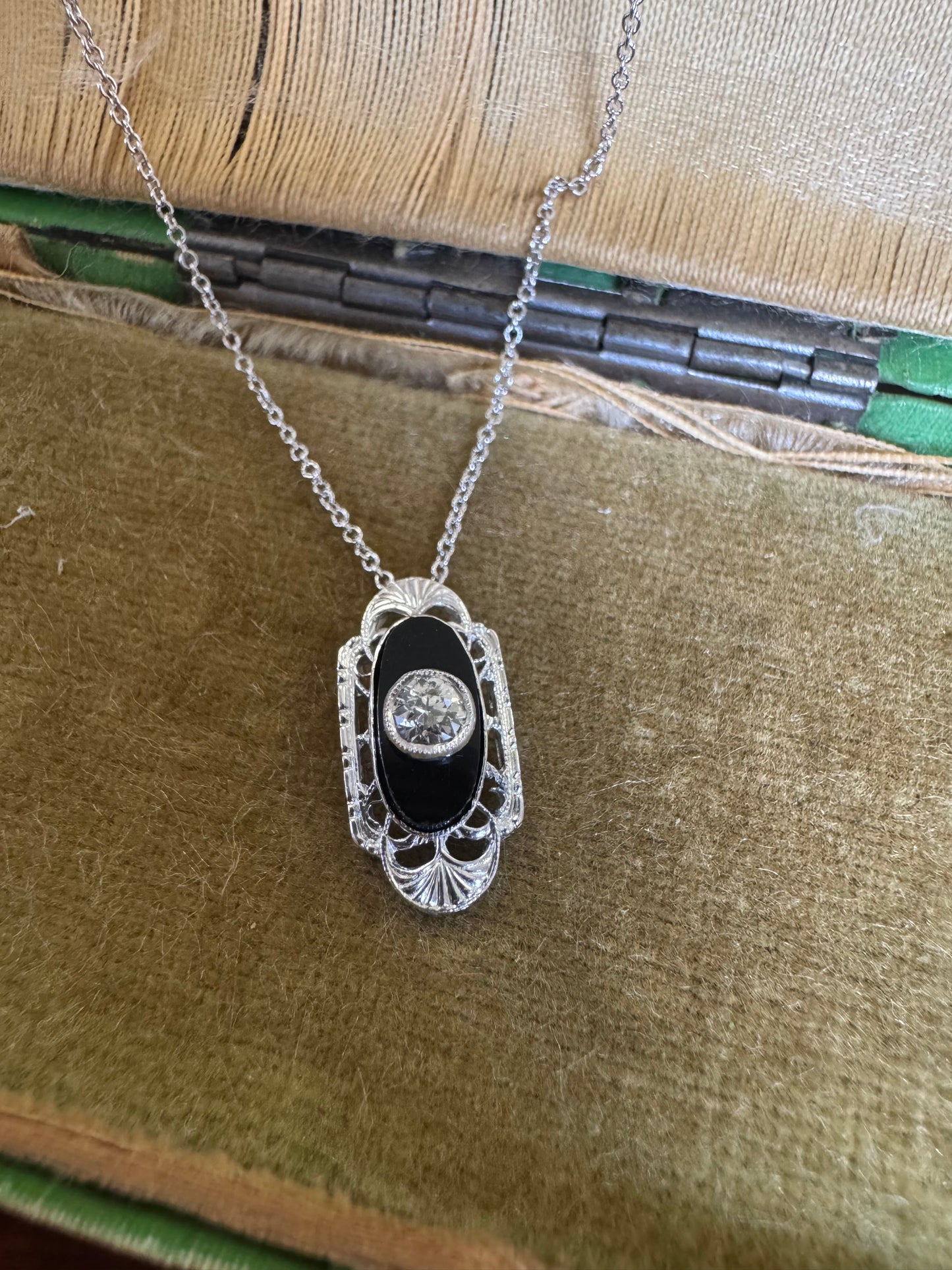 Antique black onyx and diamond pendant