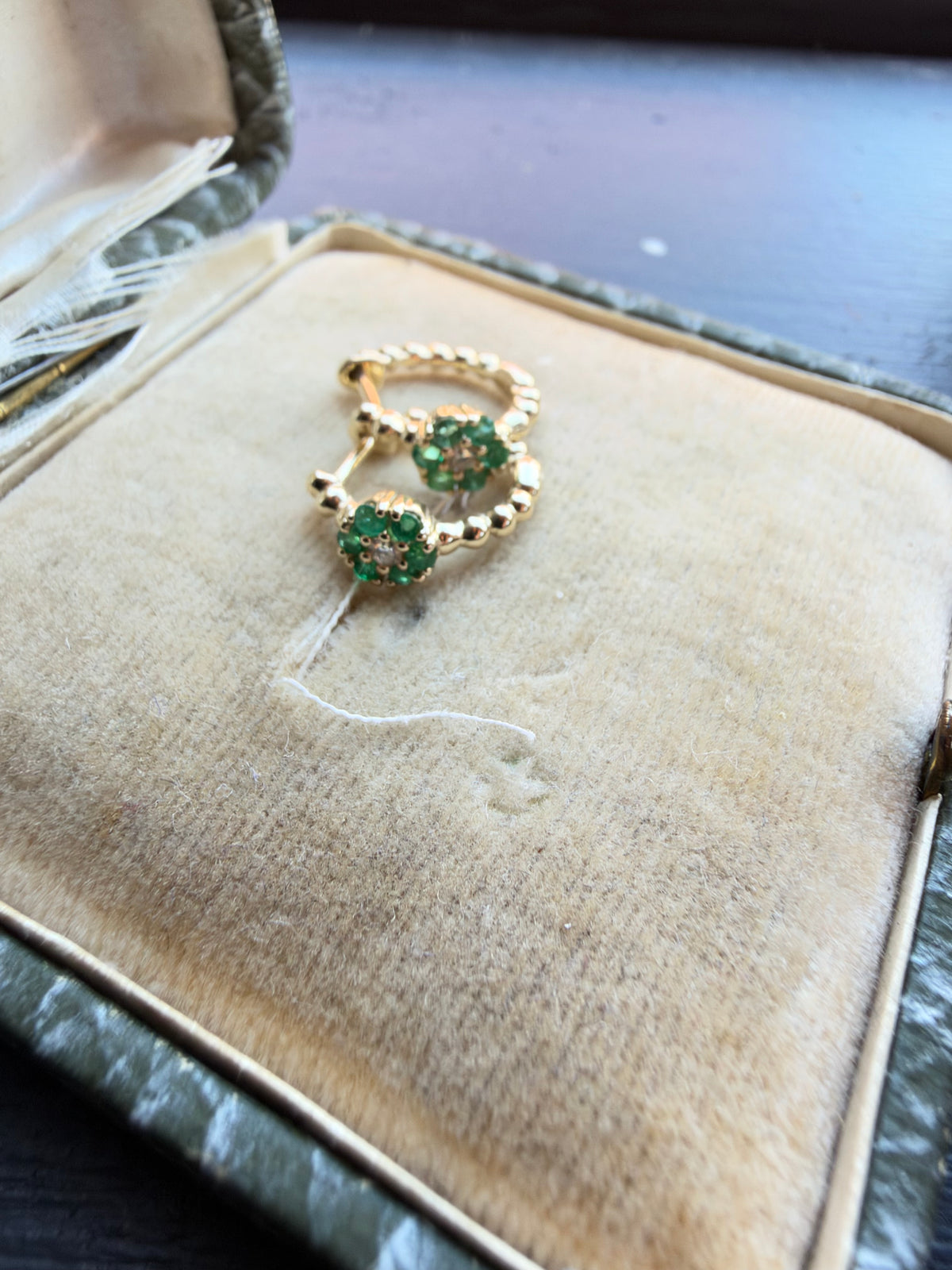 Emerald huggie hoops
