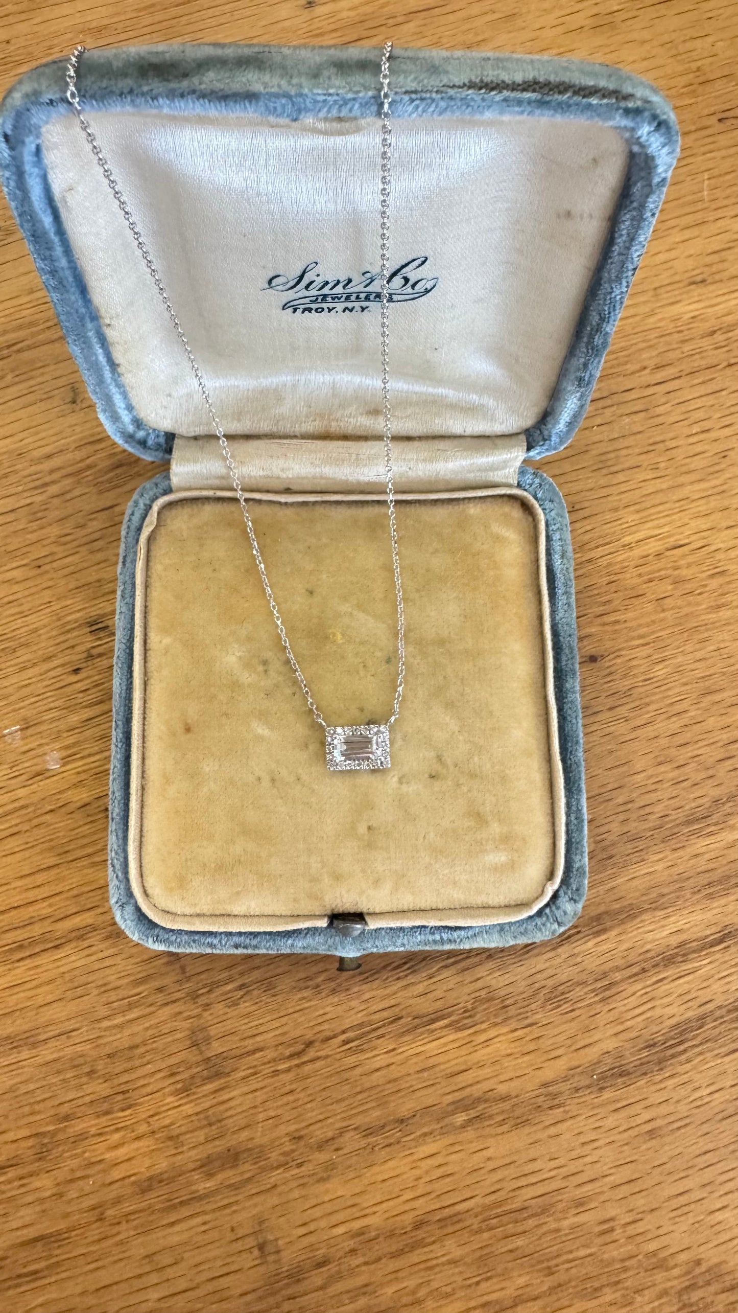 Light aquamarine and diamond halo necklace