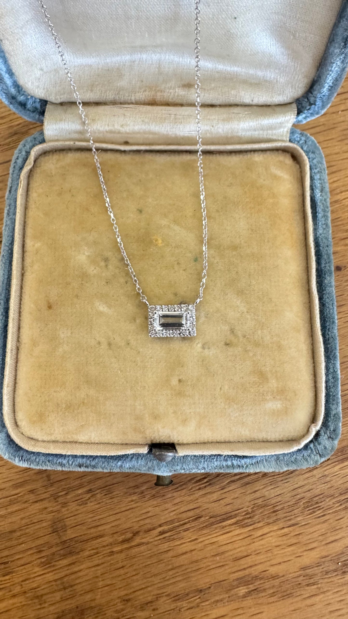 Light aquamarine and diamond halo necklace
