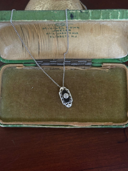 Antique black onyx and diamond pendant