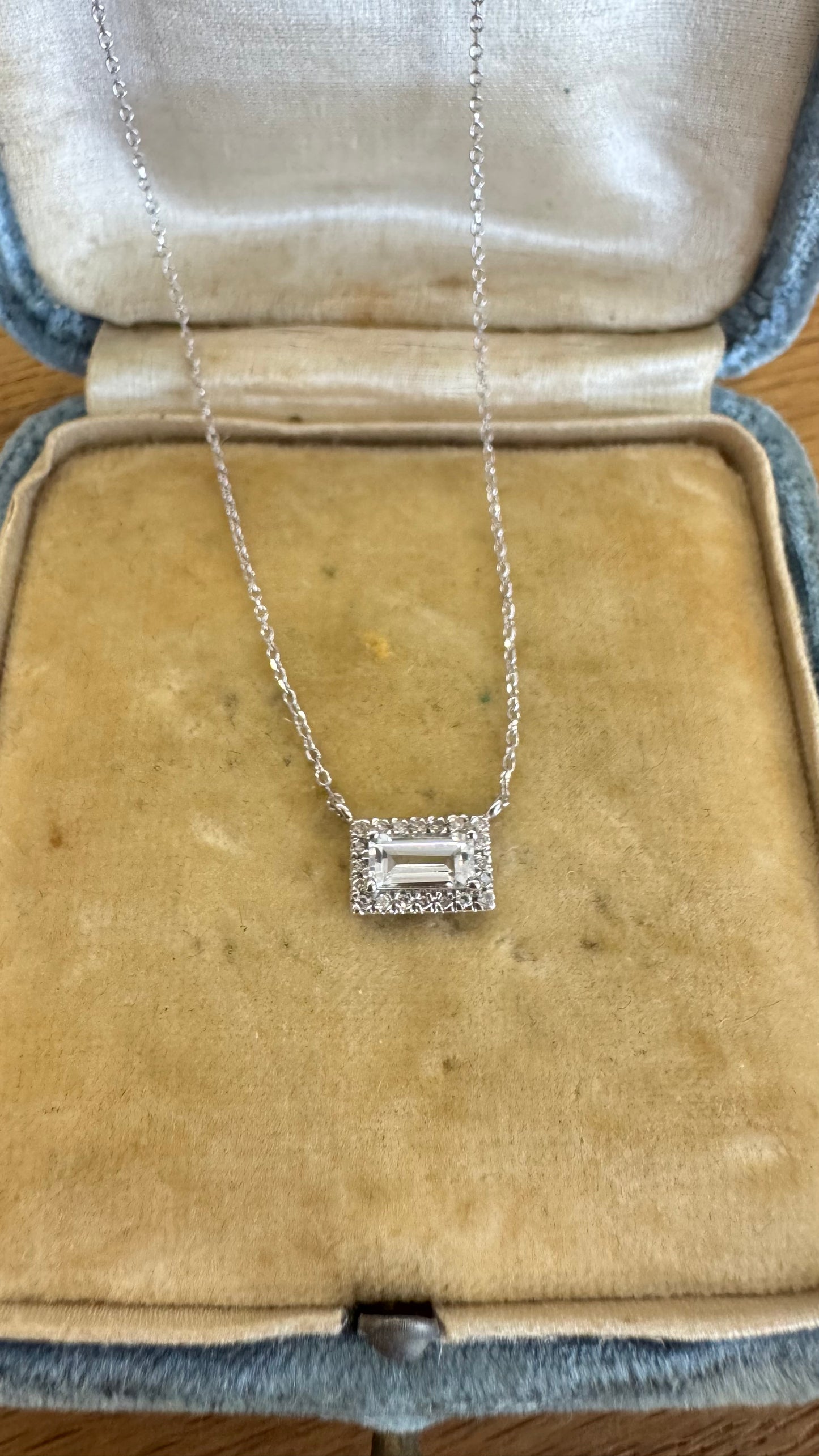 Light aquamarine and diamond halo necklace