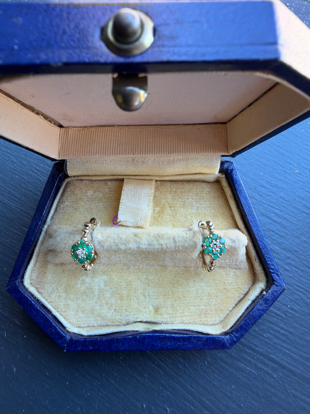 Emerald huggie hoops