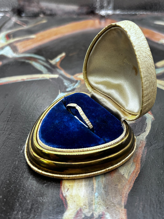 Curved band with .13ct Diamonds set in 14k yellow gold