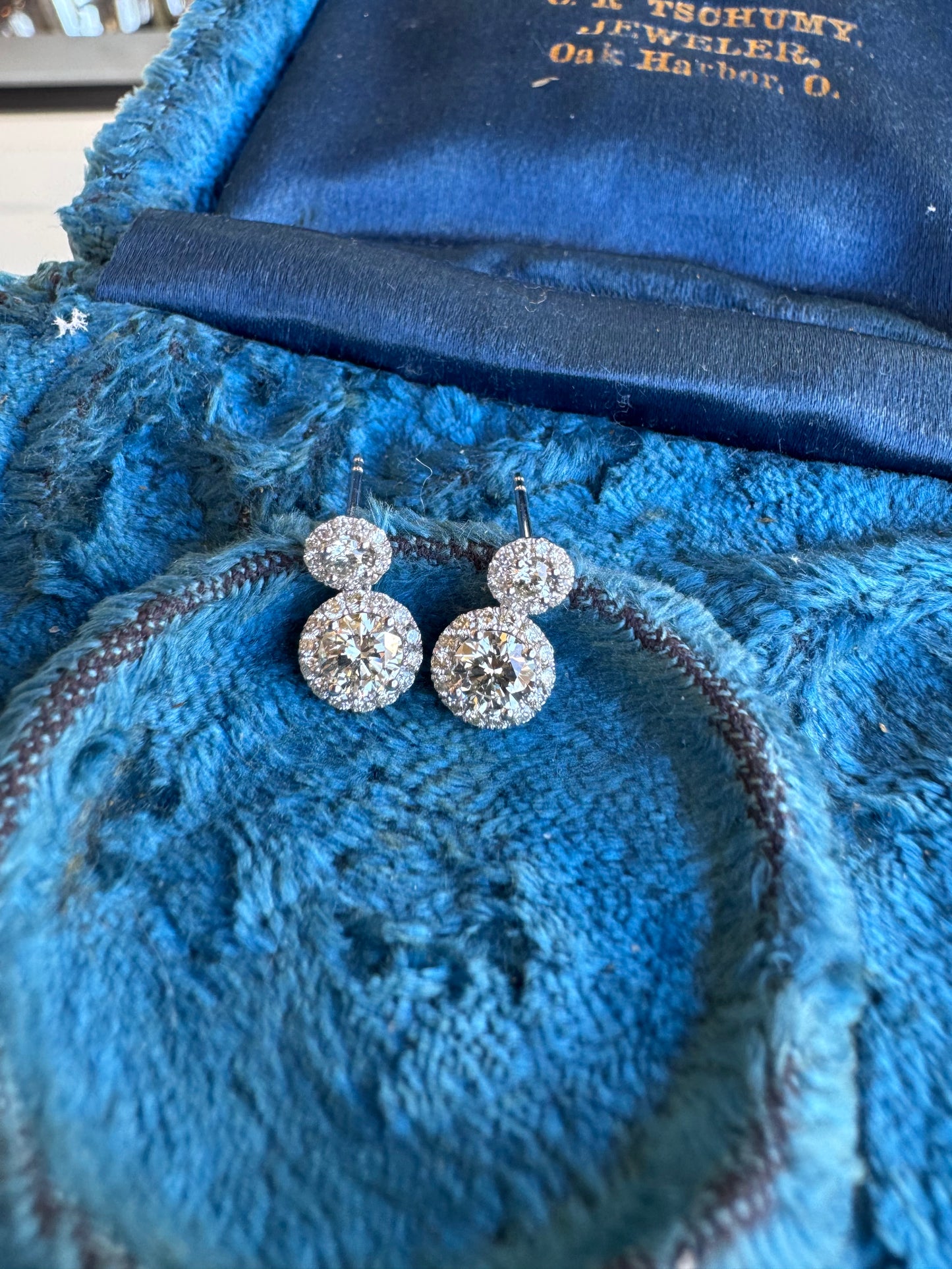 Diamond Drop Halo Earrings set in White Gold