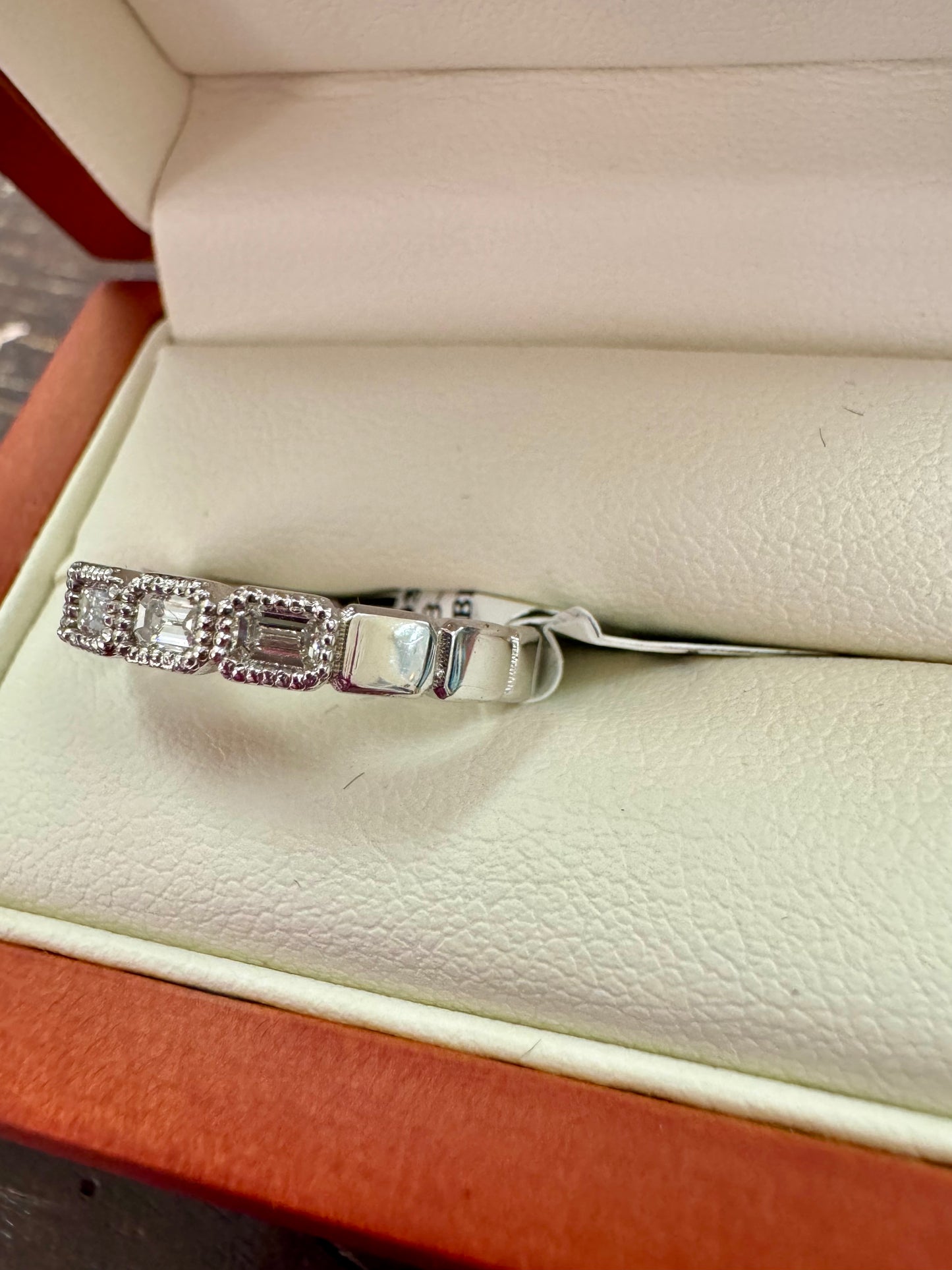 .85ct Emerald cut bezel set designer band