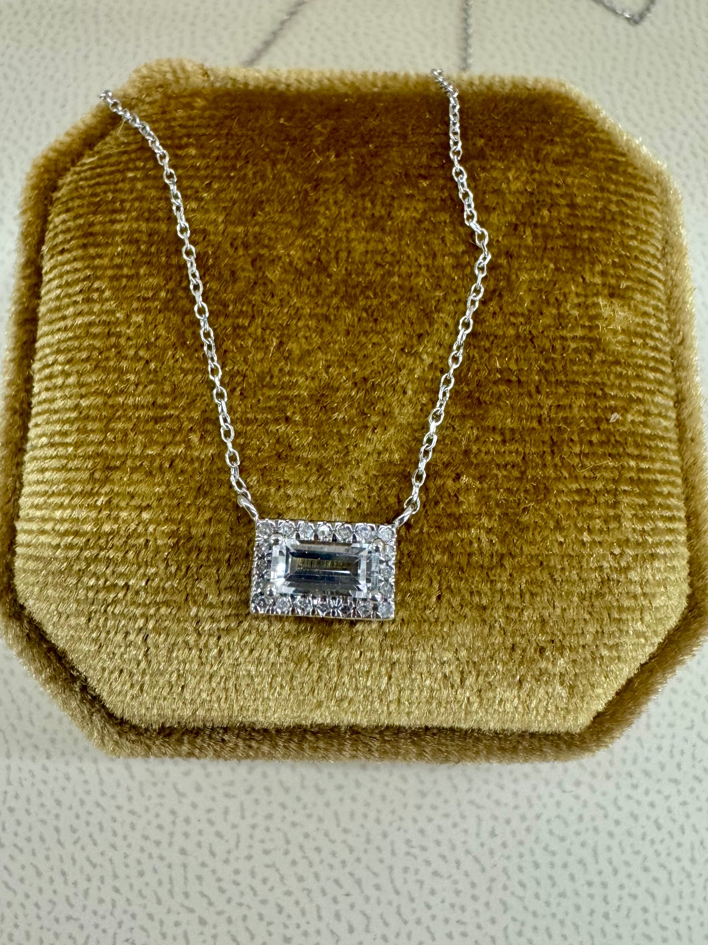 Light aquamarine and diamond halo necklace