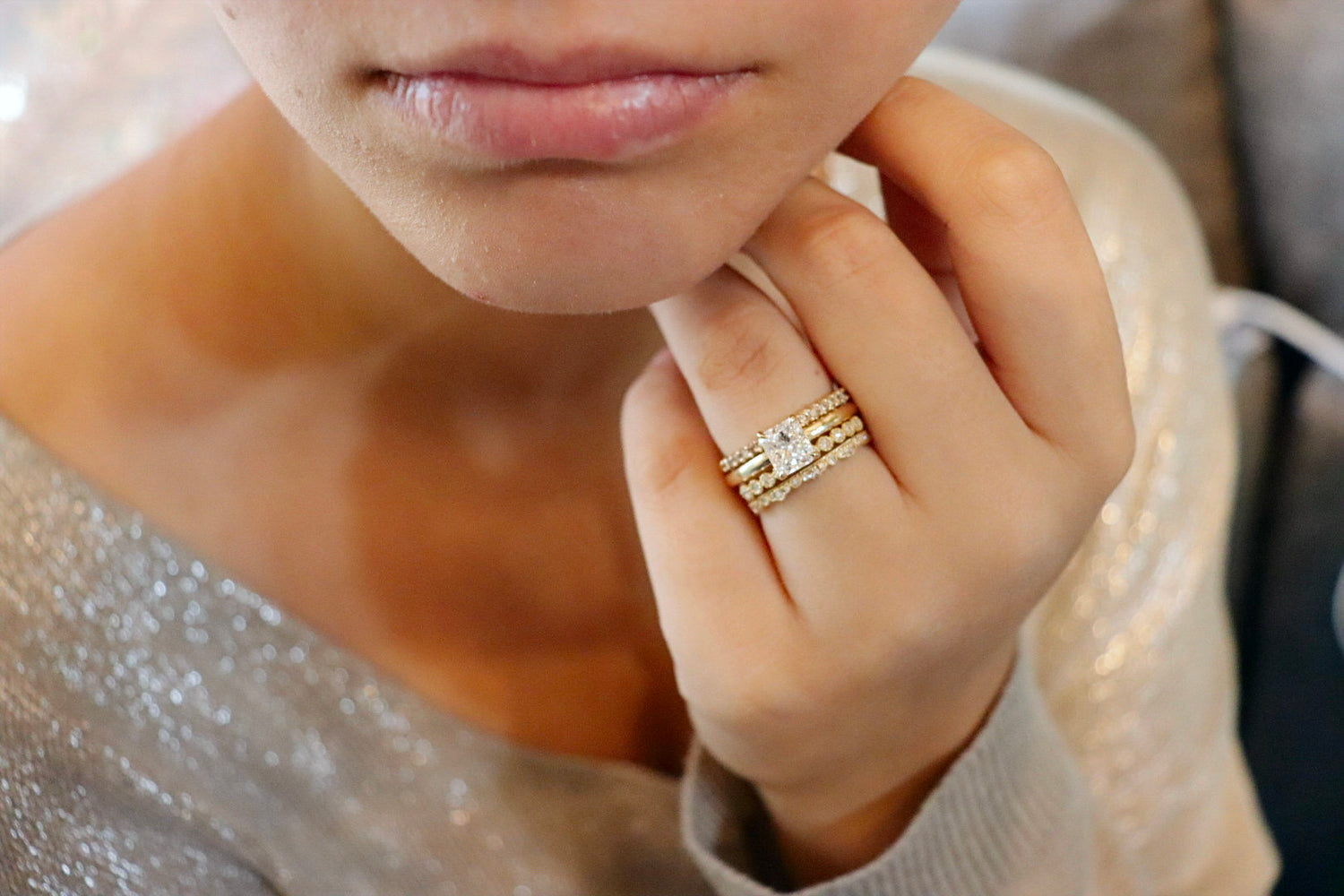 Diamond ring on model in beige glitter top